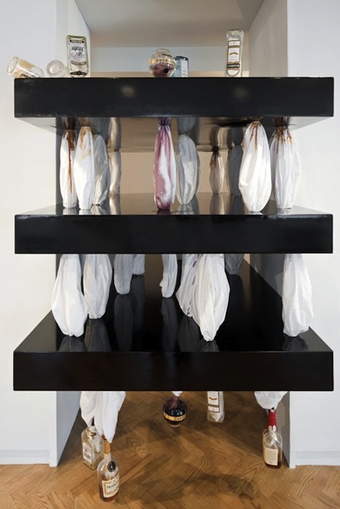 Sweat (2), 2011, Variable size. Bed sheets, liquor bottles, MDF.